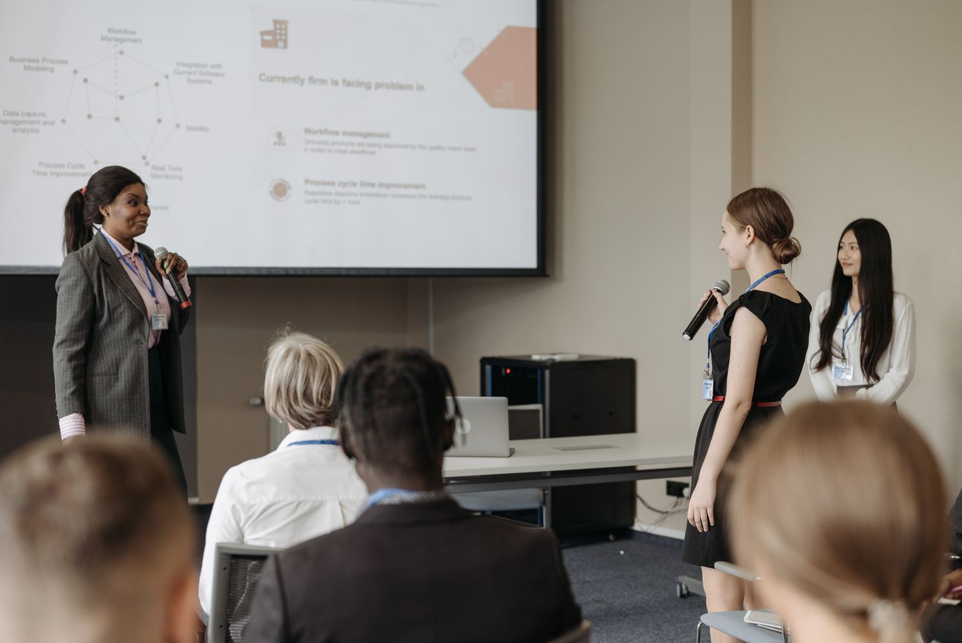 Women presenting and engaging at a corporate conference