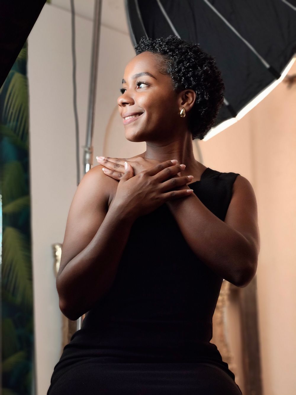 Portrait of the founder, a Nurse Practitioner, in a warm studio setting