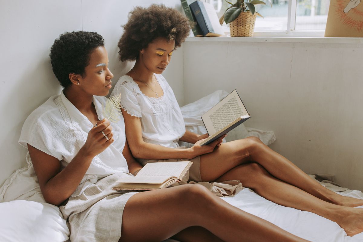 Members reading and learning together in a warm, light-filled space